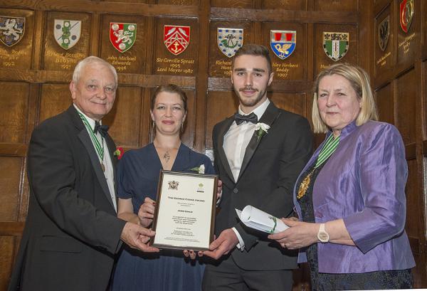Prize winners accompanied by their tutors from the colleges receiving their awards from the Master, Dr Heather Barrett-Mold OBE, at the Autumn Court Dinner 2019